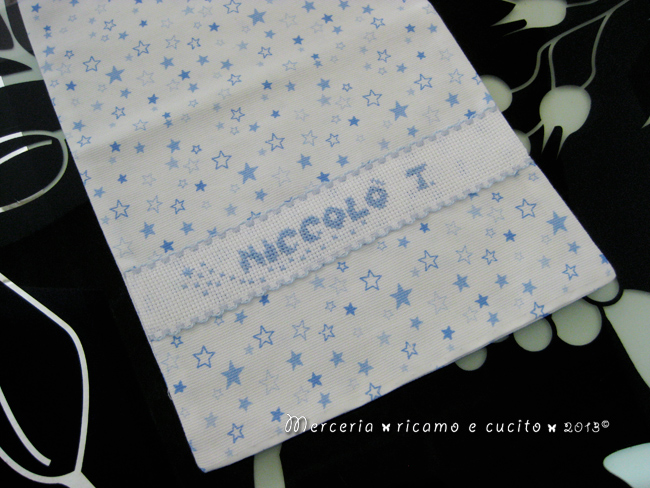 Fiocco nascita palloncino celeste e sacchetti con stelline per Niccolò