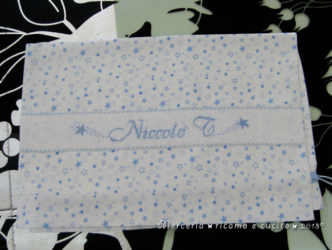 Fiocco nascita palloncino celeste e sacchetti con stelline per Niccolò