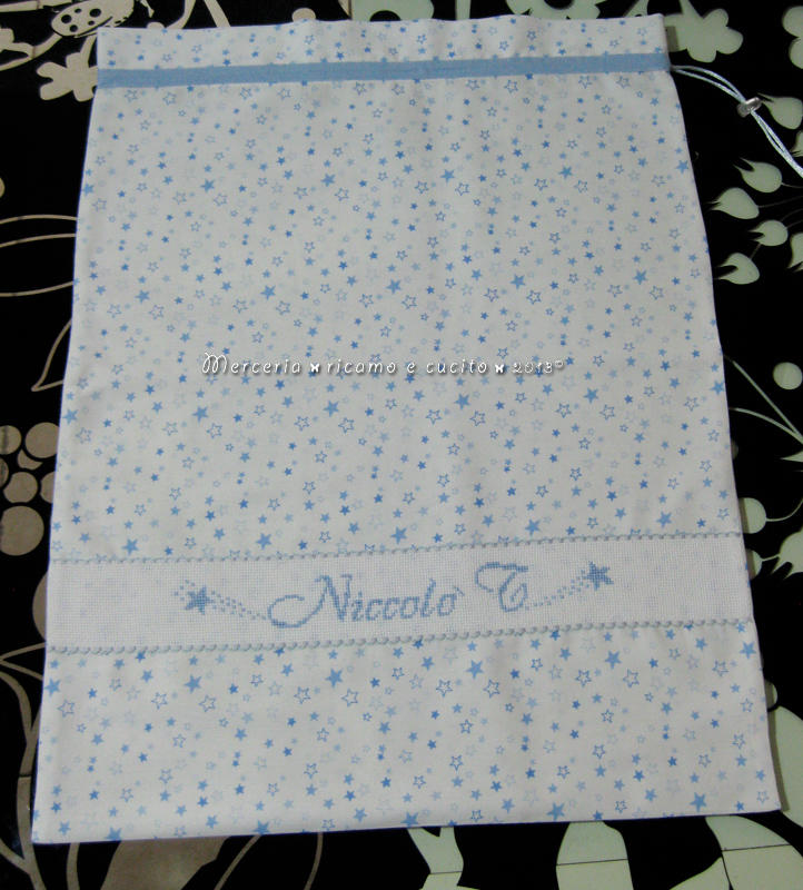 Fiocco nascita palloncino celeste e sacchetti con stelline per Niccolò