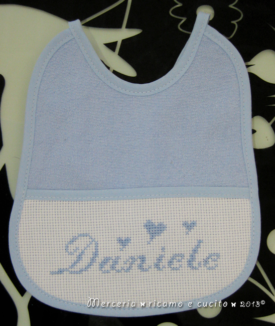 Fiocco nascita aeroplano celeste e bavette per Daniele