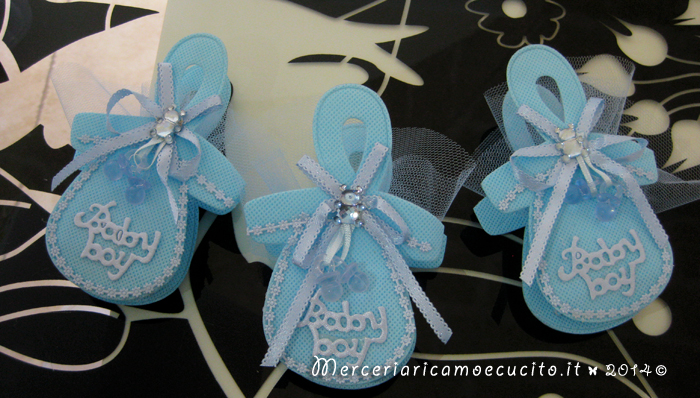 Fiocco nascita carrozzina celeste e sacchettini bomboniera ciuccio per Manuel