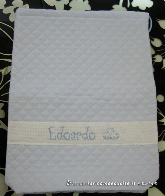 Fiocco nascita mongolfiera celeste, sacchetti per nascita, bavetta e borsa beauty per Edoardo