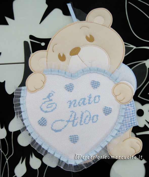 Fiocchi nascita e accappatoio per Aldo