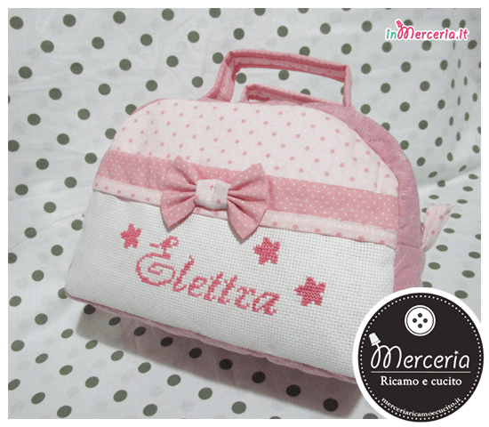 Beauty case stelle con pois rosa e clip portaciuccio per Elettra
