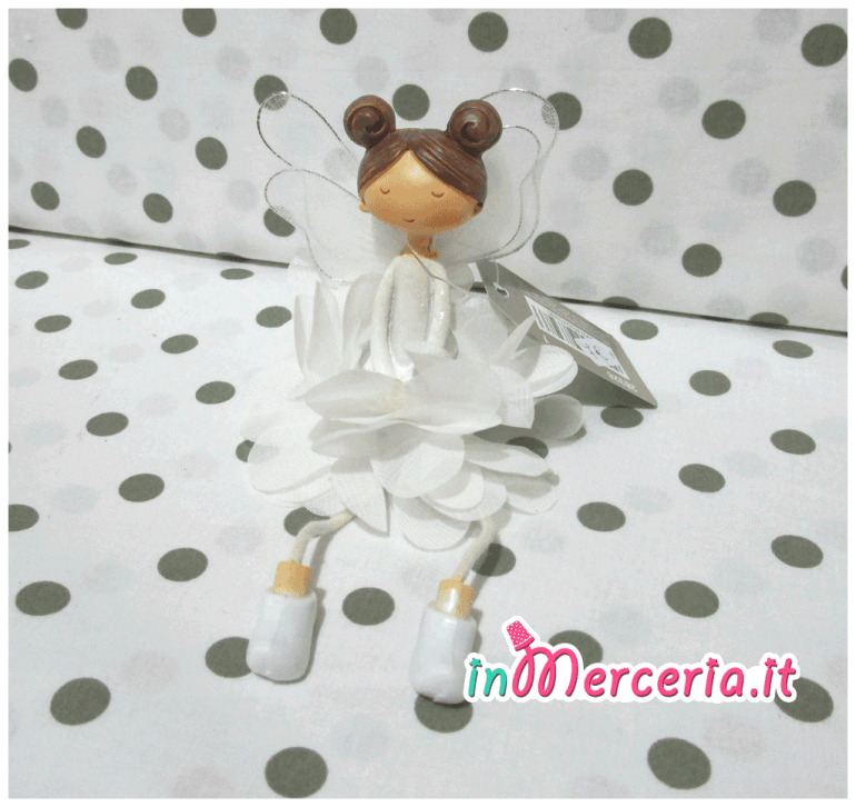 Bambolina seduta bianca